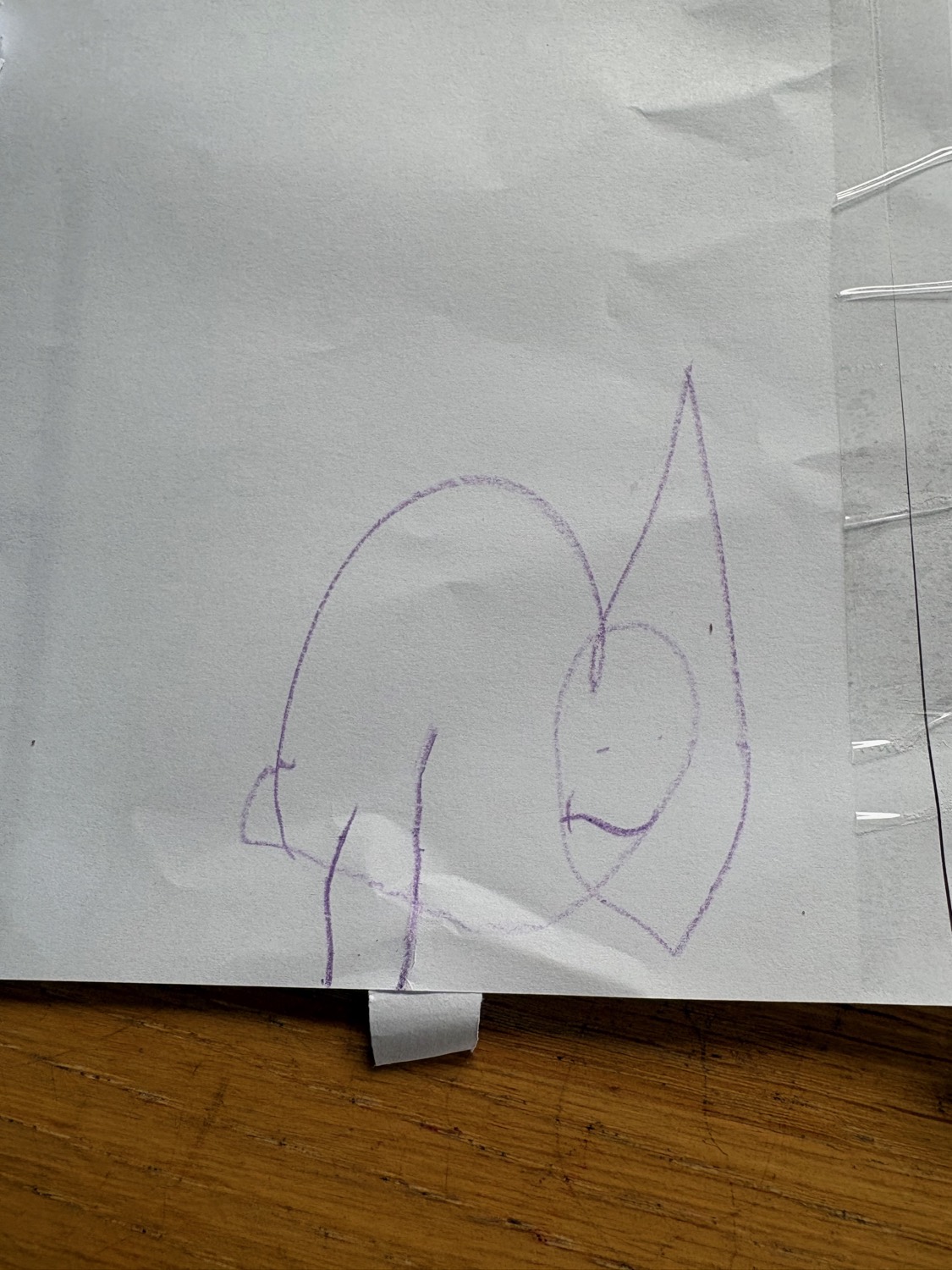 S's drawing - a purple crayon chameleon with a tall pointed crest and a stubby arm reaching out