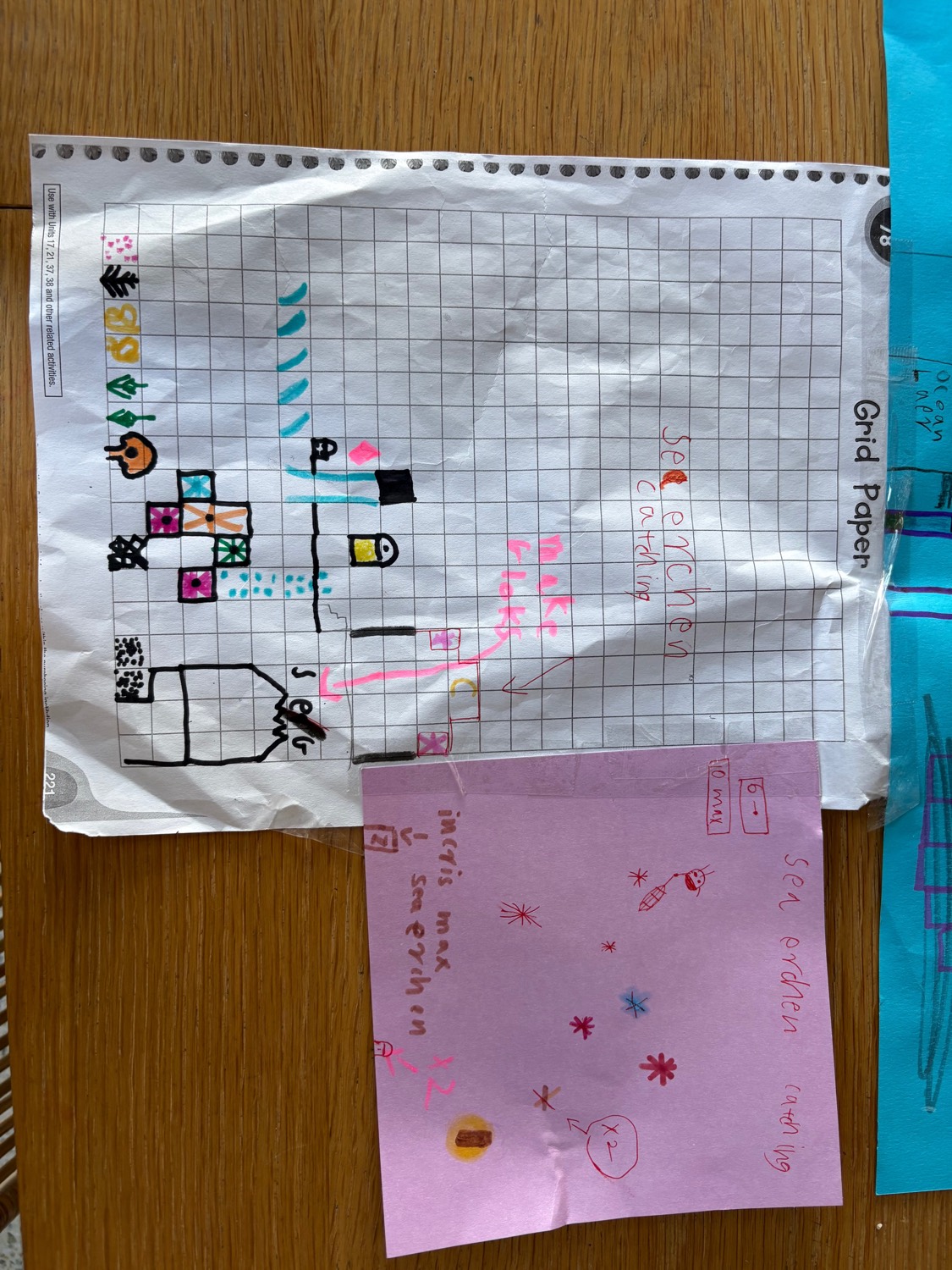 A's level map on grid paper, with a "sea erchen catching" sticky note beside it noting max quantities